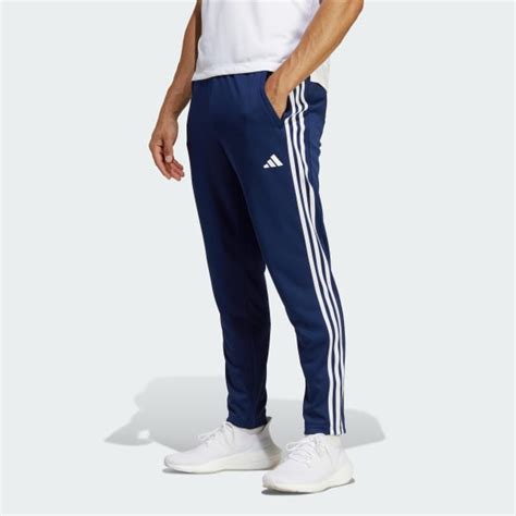 adidas jogginghose herren blau mit orangen streifen|Train Essentials 3.